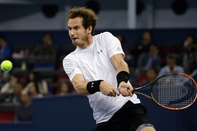 Andy Murray is a picture of concentration as he prepares to hit a double-handed backhand in his win over Tomas Berdych in Shanghai. Picture: AP