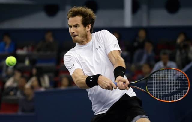 Andy Murray is a picture of concentration as he prepares to hit a double-handed backhand in his win over Tomas Berdych in Shanghai. Picture: AP