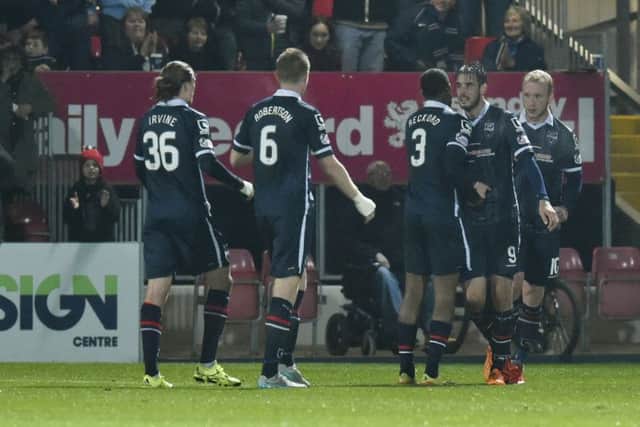 Brian Graham (2nd from right) celebrates after putting his side 1-0 up. Picture: SNS