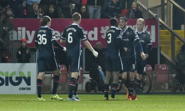 Brian Graham (2nd from right) celebrates after putting his side 1-0 up. Picture: SNS