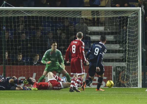 Ross County's Brian Graham (right) puts his side 1-0 up. Picture: SNS