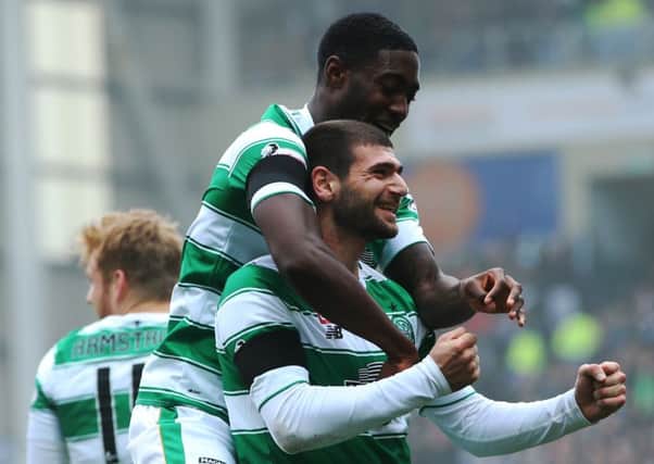 Nadir Ciftci of Celtic celebrates scoring with Tyler Blackett. Picture: Getty