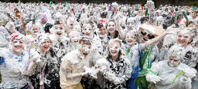 The annual fancy dress foam fight marks a 600-year-old tradition. Picture: HeMedia