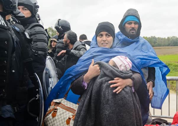 Slovenian police allow migrants and refugees to cross the Croatia-Slovenia border. Pciture: Getty Images