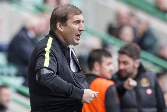 Hibs manager Alan Stubbs wears a black armband in tribute. Picture: SNS