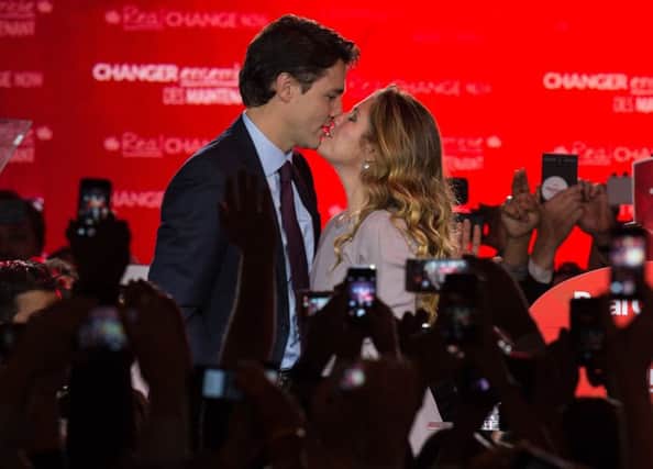 Canadian Liberal Party leader Justin Trudeau kisses wife Sophie in Montreal after his stunning general election win. Picture: Getty
