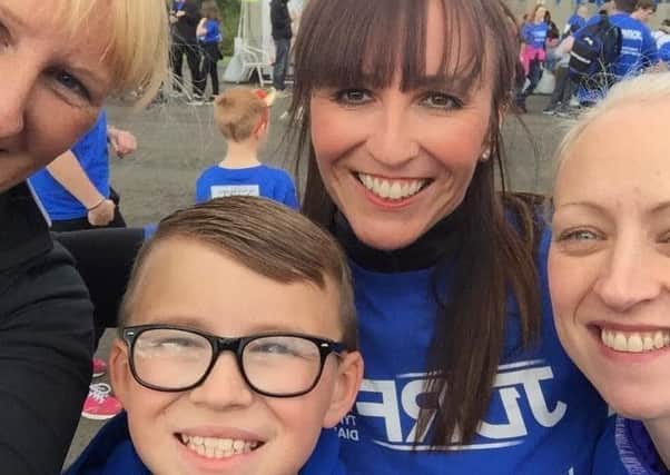 Karen Denholm (centre) and her son Sam, pictured with friends raising funds for JDRF Scotland, which works to find a cure for Type 1 diabetes