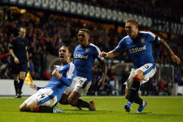 Rangers' Nicky Clark (left) celebrates his goal. Picture: PA