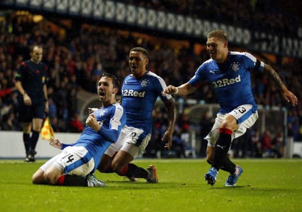 Rangers' Nicky Clark (left) celebrates his goal. Picture: PA