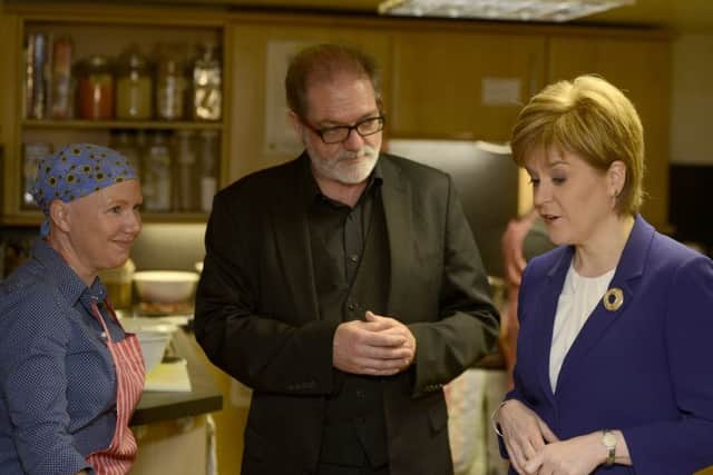 First Minister Nicola Sturgeon at Cyrenians with Ewan Aitken and cookery tutor Sue O'Neill. Picture: Julie Bull