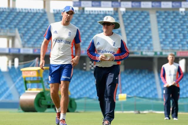 England captain Alastair Cook and coach Trevor Bayliss during a nets session at Dubai Cricket Stadium yesterday.  Picture: Getty Images