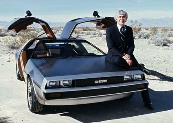 Company founder John Z DeLorean poses with a DMC-12 concept car in  1980. Photo: Techautos.