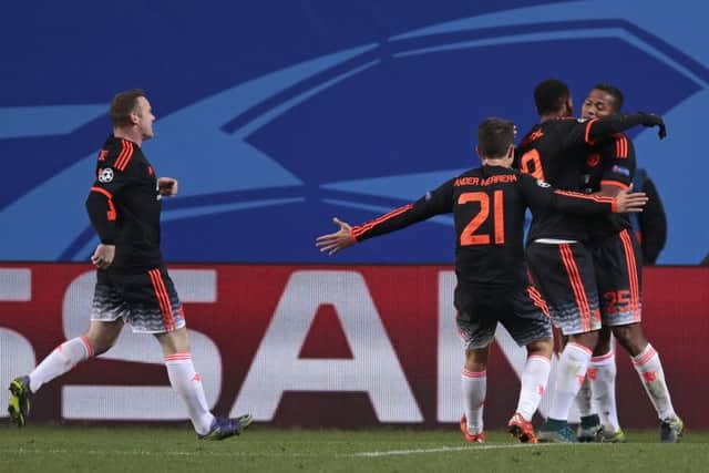 Anthony Martial, centre, celebrates with his teammates after grabbing his goal. Picture: AP