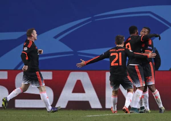 Anthony Martial, centre, celebrates with his teammates after grabbing his goal. Picture: AP