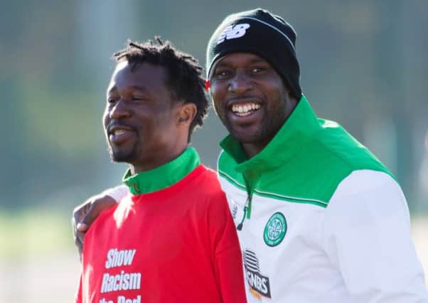 Carlton Cole, picture right with Efe Ambrose, impressed enough while training with Celtic to earn a deal.  Picture: SNS