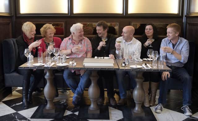 Left to right, Lin Anderson, Sue Lawrence, Val McDermid, Ian Rankin, Chris Brookmyre, Jenni Fagan and Doug Johnstone toast the new venture. Picture: Sandy Young