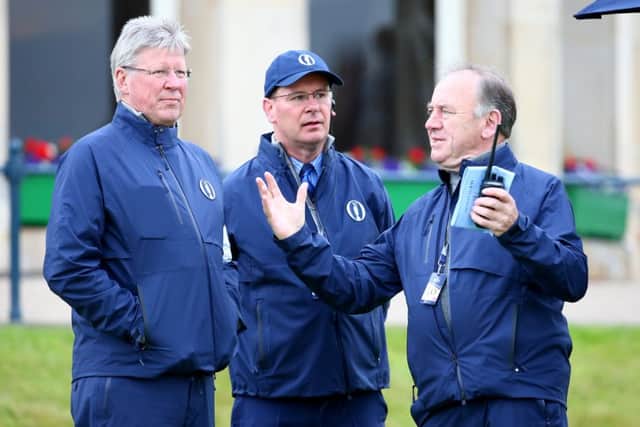 New R&A chief executive Martin Slumbers, left, discusses administrative matters with his predecessor, Pater Dawson, right. Picture: Getty