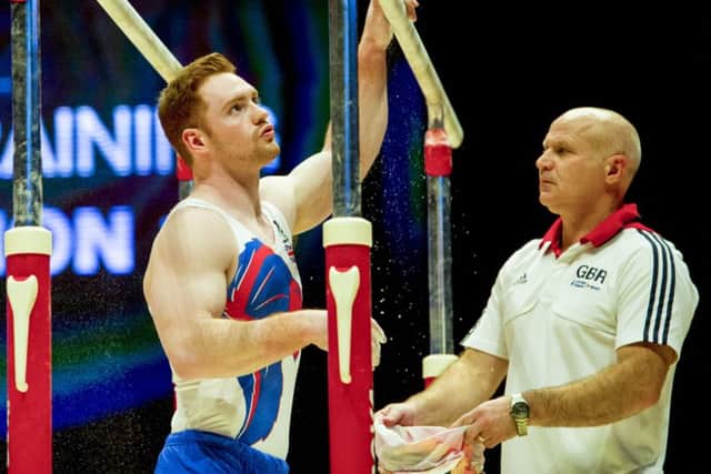 Dan Purvis on the parallel bars during training at the SSE Hydro. Picture: SNS Group