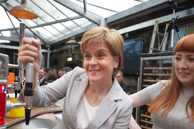 First Minister Nicola Sturgeon attends the opening of the Clutha Bar earlier this year.