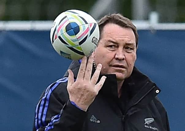 New Zealand' head coach Steve Hansen takes part  in a team training session. Picture: AFP/Getty Images