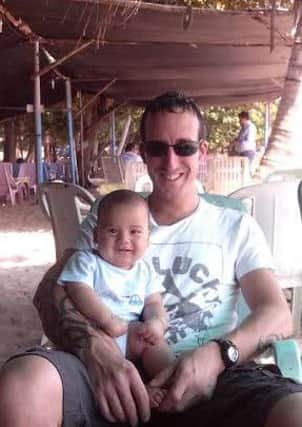 David Wyllie, who died in a car crash in Thailand in February, with his son William