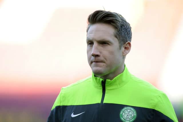 Kris Commons engaged in an angry display with coaching staff. Picture: John Devlin