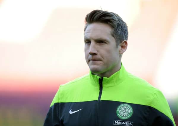 Kris Commons engaged in an angry display with coaching staff. Picture: John Devlin