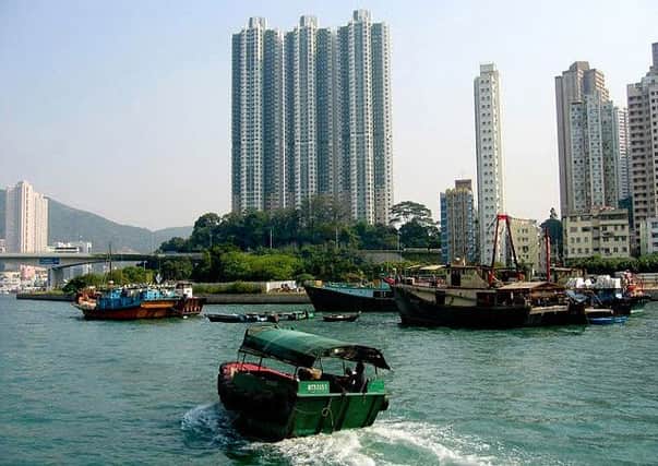 Aberdeen in Hong Kong is both a middle class enclave and home of a traditional fishing community