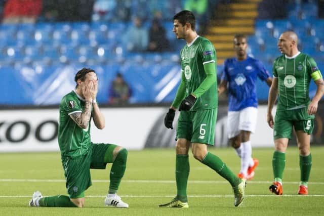 Celtic's Stefan Johansen, left, Nir Bitton, centre, and Scott Brown look dejected after the Europa League defeat by Molde. Picture: AP