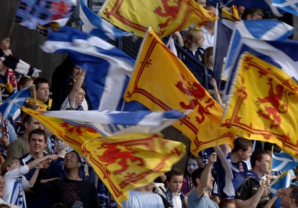 Tartan Army fans proudly show their true colours. Picture: Ian Rutherford