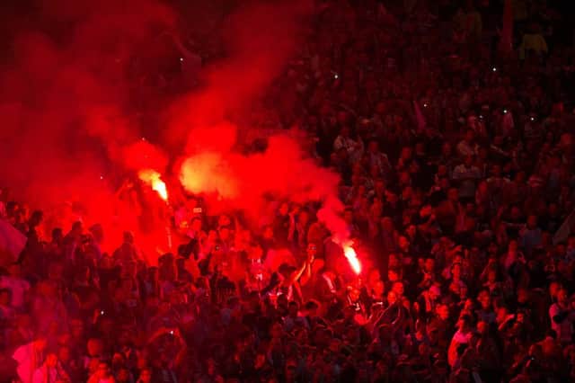 Poland fans let off flares at Hampden.  Picture: John Devlin