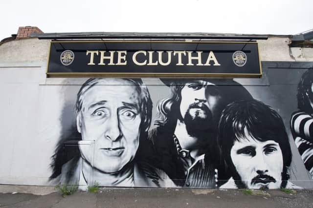 A mural outside the Clutha Vaults of famous customers. Picture: John Devlin