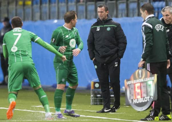 Celtic's manager Ronny Deila talks to Kris Commons during the side's Europa League Group A soccer match against Molde. Picture: AP