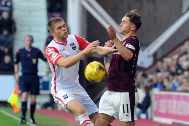Hearts' Sam Nicholson (right) and Ross County Marcus Fraser clash. Picture: Lisa Ferguson