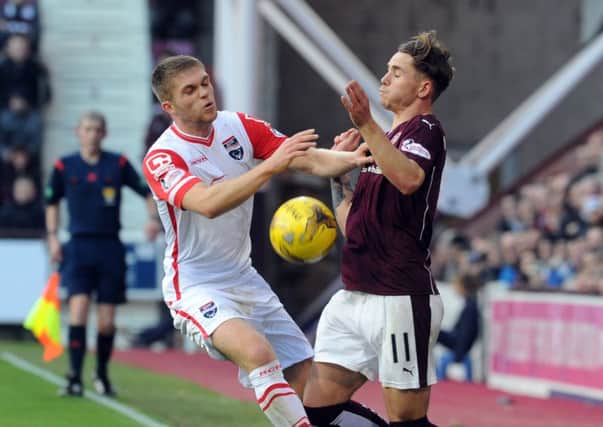 Hearts' Sam Nicholson (right) and Ross County Marcus Fraser clash. Picture: Lisa Ferguson