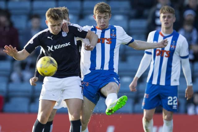 Greg Stewart (left) grapples with Kilmarnock's Stuart Findlay. Picture: SNS Group