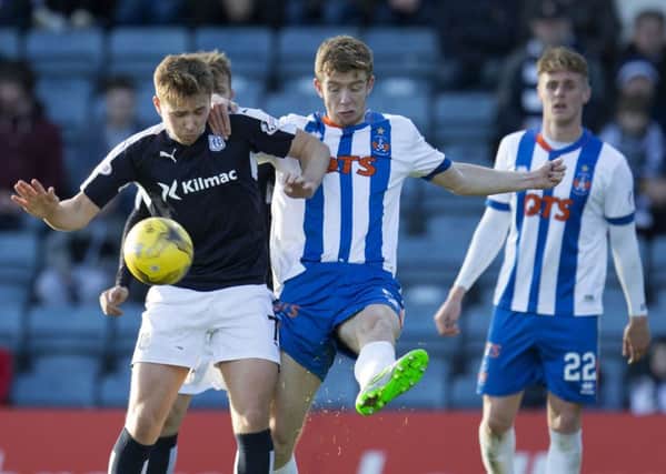 Greg Stewart (left) grapples with Kilmarnock's Stuart Findlay. Picture: SNS Group