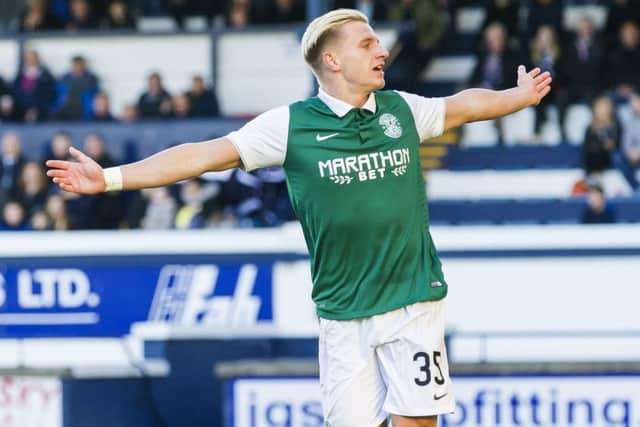 Jason Cummings races off to celebrate after scoring Hibernian's second goal of the game. Picture: SNS Group