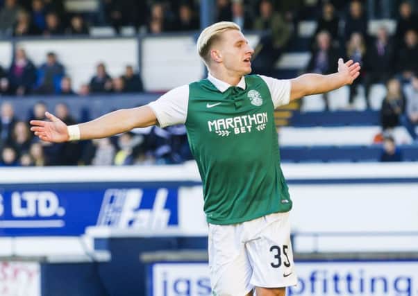 Jason Cummings races off to celebrate after scoring Hibernian's second goal of the game. Picture: SNS Group