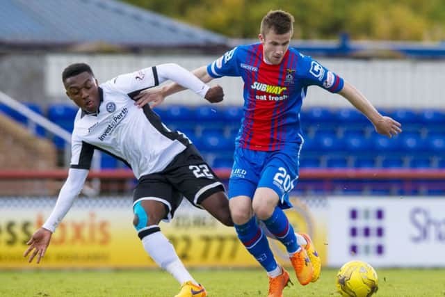 St Johnstone's Darnell Fisher (left) battles for the ball against Inverness' Liam Polworth. Picture: SNS Group