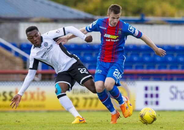 St Johnstone's Darnell Fisher (left) battles for the ball against Inverness' Liam Polworth. Picture: SNS Group