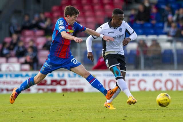 Inverness CTs Ryan Christie, left, battles for the ball against Darnell Fisher on Saturday. Picture: SNS Group