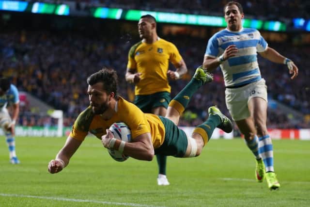 Adam Ashley-Cooper of Australia dives over to score his sides third try. Picture: Getty Images