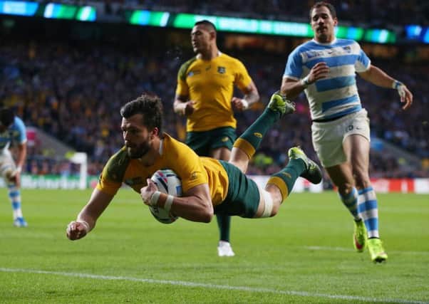 Adam Ashley-Cooper of Australia dives over to score his sides third try. Picture: Getty Images