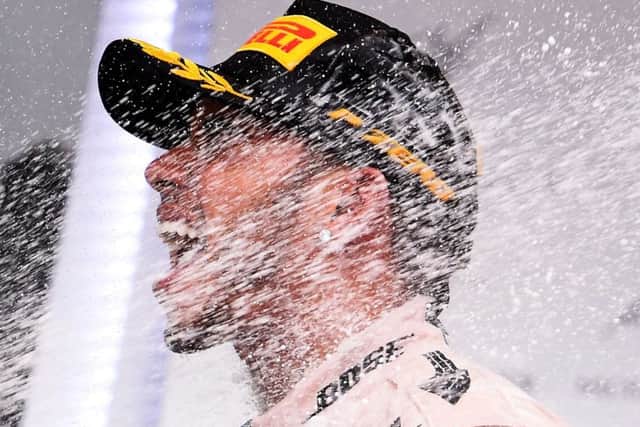 Lewis Hamilton celebrates after winning the US Grand Prix to seal his third championship. Picture: Getty Images