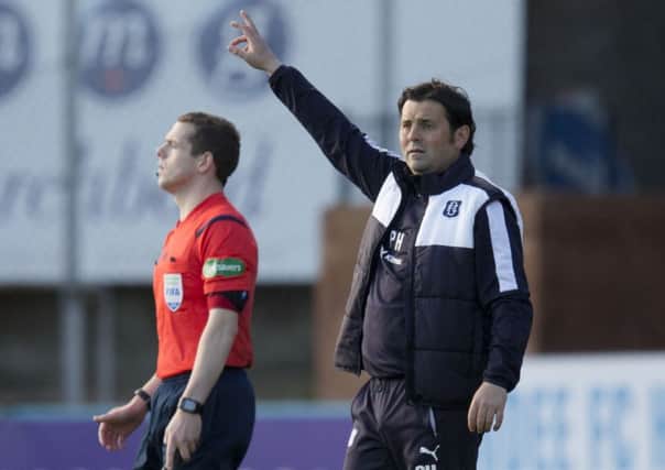Dundee manager Paul Hartley signals the referee during the match against Kilmarnock on Saturday. Picture: SNS Group