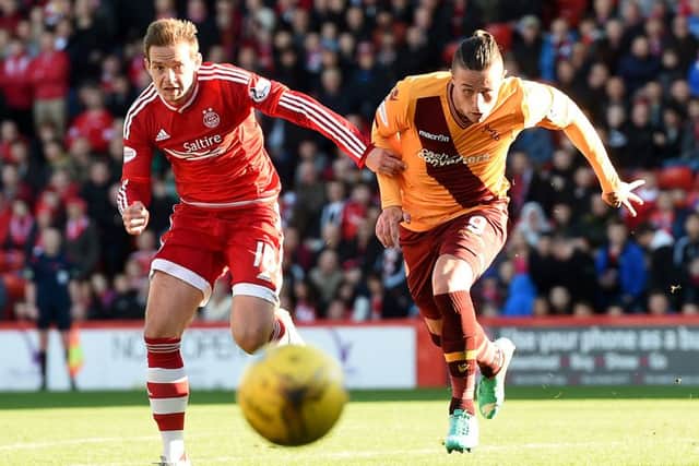 Aberdeen's Peter Pawlett and Motherwell's Wes Fletcher (right) give chase. Picture: SNS Group