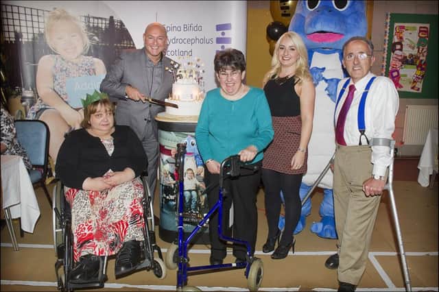 Jon Wilson, right, with supporters of SBH Scotland as it celebrates its birthday with television host John Amabile