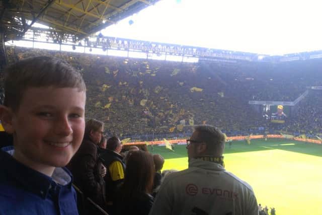 Graham Bean's son, Fraser, watches Borussia Dortmund. Picture: Graham Bean