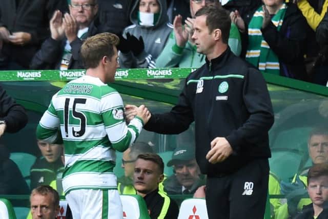 Kris Commons (left) with manager Ronny Deila as he is substituted in Celtic's 5-0 win over Dundee United. Picture: SNS
